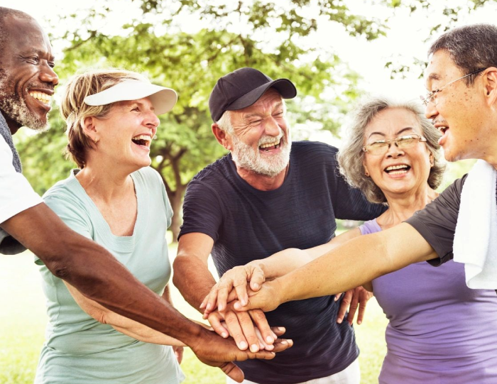 A group of people standing around each other.